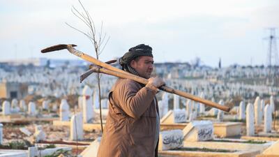 Abdul Mohsen Latif is a gravedigger in one of Idlib’s cemeteries. "I never imagined that I would bury so many people,” he said. Abd Almajed Alkarh for The National.