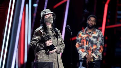 Billie Eilish accepts the Top Female Artist award. Reuters