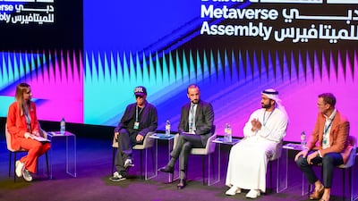 From left, Sarah Forster from 'The National', Samuel Hamilton, creative director at the Decentraland Foundation, Joe Abi Akl, chief corporate development officer of Majid Al Futtaim, Ali Sajwani, general manager of operations at Damac Properties, and Guy Parsonage, metaverse lead at PwC, during a panel discussion at the Dubai Metaverse Assembly on Wednesday. Khushnum Bhandari / The National