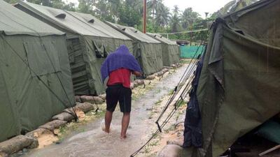 A man walks between tents at Australia’s regional processing centre on Manus Island in Papua New Guinea, in February 2014. Agence France-Presse / Refugee Action Coalition