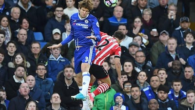 Chelsea wing-back Marcos Alonso wins an aerial duel with vies with Southampton full-back Cedric Soares. Justin Tallis / AFP