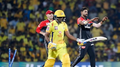 Royal Challengers Bangalore's Mohammad Siraj, right, celebrates the dismissal of Chennai Super Kings' Ambati Rayadu, center, during the VIVO IPL T20 cricket match between Chennai Super Kings and Royal Challengers Bangalore in Chennai, India9. AP Photo