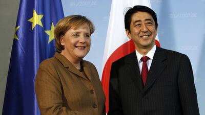 Angela Merkel, then Germany's chancellor, shakes hands with Mr Abe in Berlin in January 2007. Bloomberg