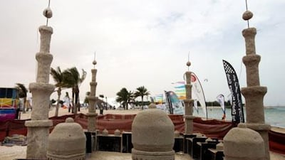 At Mirfa Beach, the sand sculpture replica of the Sheikh Zayed Mosque begins to take shape in time for the Al Gharbia Water Sports Festival.