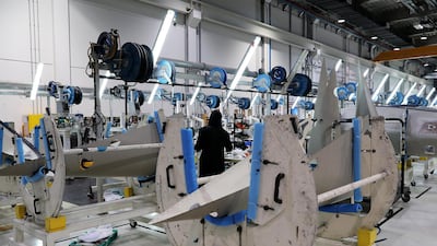 A Worker working on the parts for Airbus and Boeing in the Assembly section at the Strata Manufacturing facility in Al Ain. Pawan Singh/The National