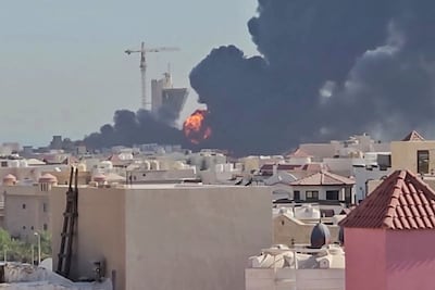 Smoke rises after an Iranian strike as seen from Mangaf, south of Kuwait City, on Saturday. AFP