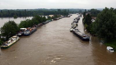 Boats are lined up on the flooded Loing Canal on June 2, 2016 in St Mammes, where the Loing joins the Seine south of Paris, France. The Louvre museum took the radical decision of closing on June 3, 2016 to evacuate artworks on fears the River Seine might burst in its banks. AP Photo/Jerome Delay