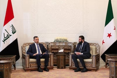 Syria's de facto leader Ahmad Al Shara with Iraq's intelligence chief Hamid Al Shatri in Damascus on December 26 last year. AFP