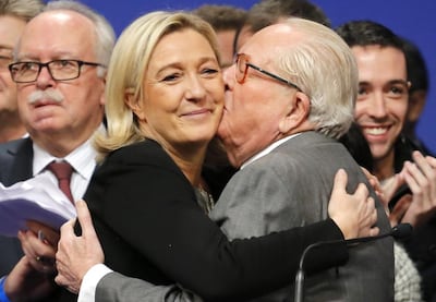 Jean-Marie Le Pen congratulates his daughter Marine after she is re-elected as leader of the French National Front party in 2014. AP