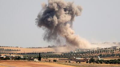 Smoke billows during pro-regime bombardments in the area of Maar Hitat in Syria's northern Idlib province on August 20, 2019. AFP