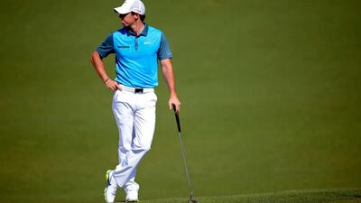 Rory McIlroy got a lesson on how to read the greens at Augusta National from his playing partner on April 12, 2014, non-competing marker Jeff Knox, who is a member of the club. Harry How / AFP