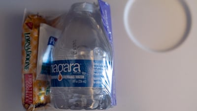 A snack, bottled water and hand sanitiser sealed in plastic during the Avelo Airlines inaugural flight. Bloomberg