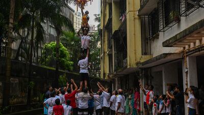 Devotees play Dahi Handi in Mumbai. AFP
