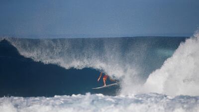 Surfer Joel Parkinson competes during the Billabong Pipe Masters at the Banzai Pipeline in Pupukea on the island of Oahu, Hawaii. Eric Thayer / Reuters