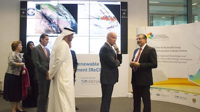 Joe Biden, second right, speaks with Adnan Amin, Director-General of Irena, right, during a tour of Masdar City. With them are Dr Sultan Ahmed Al Jaber, Minister of State and Chairman of Masdar, left, Barbara Leaf, US Ambassador to the UAE, back left, and Reem Ibrahim Al Hashemi, Minister of State for International Cooperation, back second left. Razan Al Zayani for Crown Prince Court - Abu Dhabi