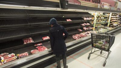 A customer surveys the depleted meat section of a grocery store, as residents prepared for Winter Storm Jonas in Alexandria, Virginia, on January 21, 2016. Michael Reynolds / EPA