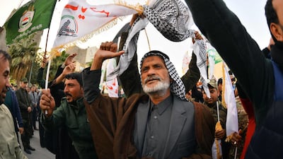 Iraqi mourners wave flags as the coffins of slain Iraqi paramilitary chief Abu Mahdi al-Muhandis, Iranian military commander Qasem Soleimani and eight others towards the Imam Ali Shrine in the shrine city of Najaf in central Iraq. AFP