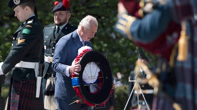 Prince Charles and Camilla, Duchess of Cornwall participate in a wreath laying ceremony at the National War Memorial in Ottawa, during their Canadian Royal tour, on Wednesday, May 18, 2022. AP