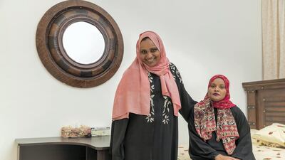Alia Al Sayed (L) suffered from epilepsy from the age of two. Her sister Lemia (R) is her care giver. Antonie Robertson / The National