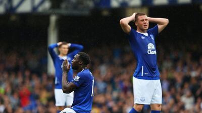 Romelu Lukaku of Everton reacts with teammate James McCarthy during their loss to Manchester City on Sunday. Alex Livesey / Getty Images