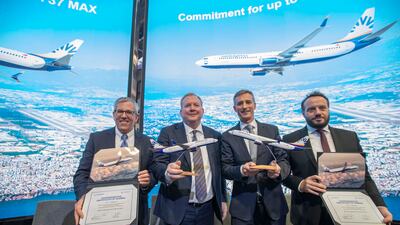 Form left, Brad McMullen, senior vice president for commercial sales and marketing at Boeing Commercial Airplanes, Stan Deal, president and chief executive of Boeing Commercial Airplanes, Max Kownatzki, chief executive of SunExpress, and Tuncay Eminoglu, deputy chief executive of SunExpress at the signing ceremony at the Dubai Airshow. Leslie Pableo / The National