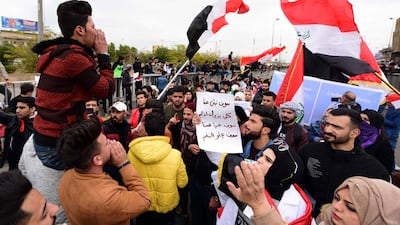 Iraqi university students carry the Iraqi national falg during a strike and protests in central Baghdad, Iraq. EPA