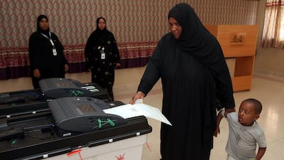 An Omani woman casts her ballot in municipal elections on December 25, 2016 at a polling station in Al Suwayq, northeastern Oman. Mohammed Mahjoub/AFP