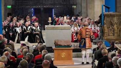 Lord Lyon King of Arms, Joseph Morrow, addresses the congregation about the significance of the Stone of Destiny. PA