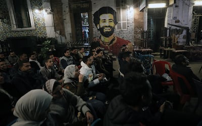 Egyptian football fans watch the 2021 Africa Cup of Nations match between Nigeria and Egypt on a screen in Cairo, Egypt, 11 January 2022. EPA / KHALED ELFIQI