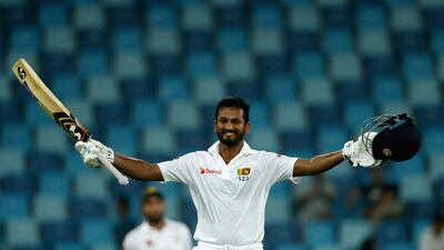 Dimuth Karunaratne of Sri Lanka celebrate after reaching his century during day one of the Second Test between Pakistan and Sri Lanka in Dubai (Photo by Francois Nel/Getty Images)