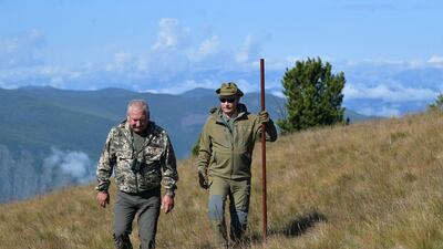 Russian President Vladimir Putin (R) enjoys a walk during his leisure time in the Siberian Taiga area, Russia. EPA