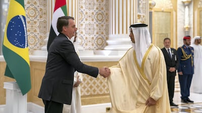Jair Bolsonaro, President of Brazil, greets Sheikh Mansour bin Zayed, Deputy Prime Minister and Minister of Presidential Affairs, during an official reception at Qasr Al Watan. Ministry of Presidential Affairs