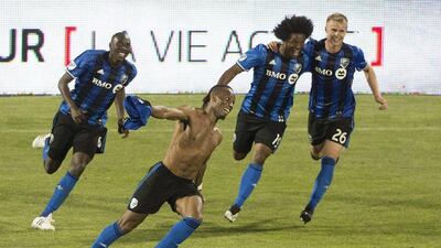 Didier Drogba takes his shirt off in celebration after scoring Montreal Impact's last-minute winner against Los Angeles Galaxy. Graham Hughes / AP Photo