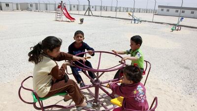 Syrian refugee children play in the park of the UAE-funded Mrigb al-Fuhud refugee camp near the Jordanian city of Zarqa. AFP Photo