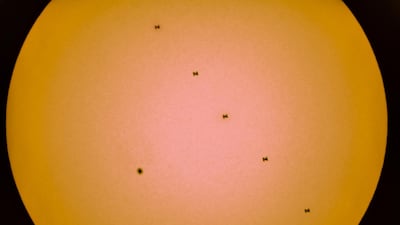 A composite image of 5 separate photographs taken with a single fixed camera shows a sunspot and the International Space Station in silhouette as it transits the Sun, as seen from near Tbilisi, Georgia. Picture taken through a telescope. Reuters