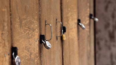 A shop is locked in a market during a nation-wide strike call given by various farmers' organisations as a protest against the new agricultural laws introduced by the government and to demand a roll-back of those laws, in Amritsar, India. EPA