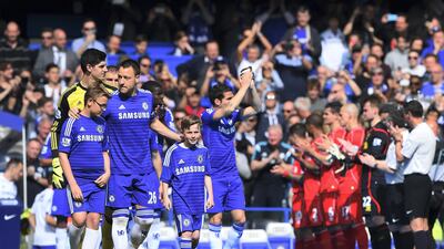 Captain John Terry leads Chelsea through a guard of honour by the Liverpool players in 2015. Getty