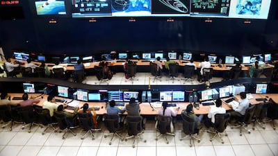 Indian scientists and engineers monitor the Mars Orbiter Mission. Manjunath Kiran / AFP