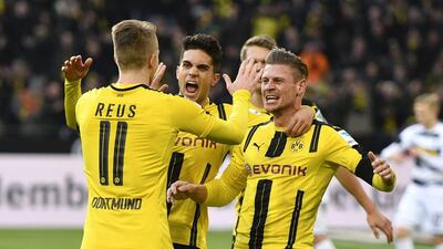 Dortmund's Marco Reus is congratulated during the team's Bundesliga match against Borussia Moenchengladbach in Dortmund, Germany, on December 3, 2016. Martin Meissner / AP