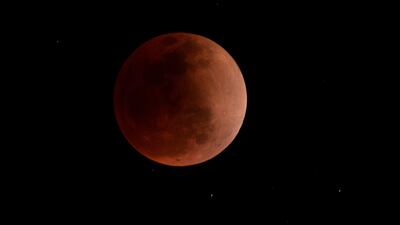 The blood moon, similar to this one whose pictures were taken in Peru during a total lunar eclipse in May, will be visible in certain parts of the world on November 8. AFP