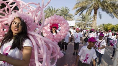 Participants in the Burjuman Pink Walkathon stretch their legs around Zabeel Park in Dubai on Friday in support of the Safe and Sound breast cancer awareness campaign. Antonie Robertson / The National