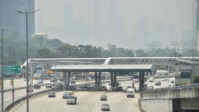 The Petronas Twin Towers and other buildings are seen shrouded by haze in Kuala Lumpur following huge forest fires in Indonesia. AFP