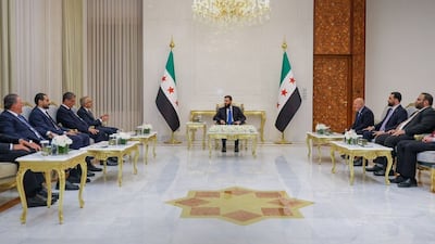 Syrian President Ahmad Al Shara, centre, meets Lebanese Economy Minister Amer Bisat, fourth left, in Damascus. Photo: Sana