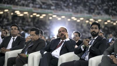 A man looks onto the stage at Dubai International Cricket Stadium. Photo by Reem Mohammed/The National