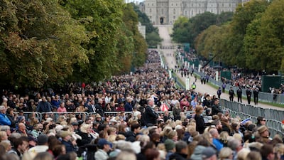 Members of the public on the Long Walk watch the state funeral of Queen Elizabeth II on big screens. Getty Images