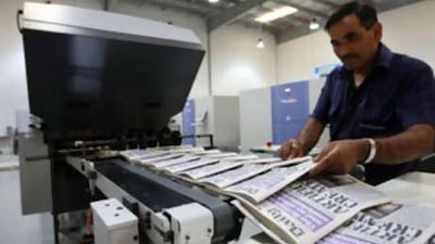 British newspapers roll off the printing press at the new press at Atlas Printers in Dubai yesterday.