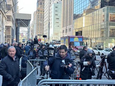 Journalists gather outside Trump Tower on Monday. Adla Massoud / The National