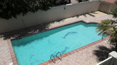 The family shares a swimming pool with a neighbouring villa