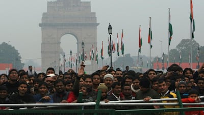 The landmark India Gate monument is pictured as spectators look on at the departing motorcade of US president Barack Obama at the end of the country’s Republic Day Parade in New Delhi. Tengku Bahar/AFP Photo