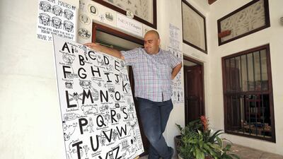 Artist Abdulla Lutfi with his creation. Chris Whiteoak / The National